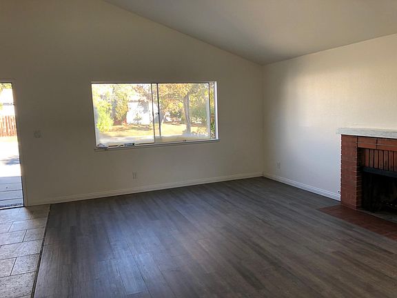 Front room looing toward front yard and entry door on the left.