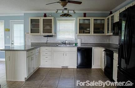 View downstairs hallway
						:
						Great view of Pergo flooring downstairs