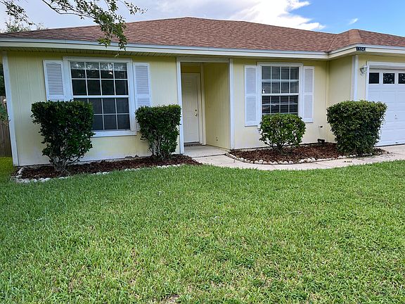 4 br 2 bath home with an inground swimming pool and 2 car garage