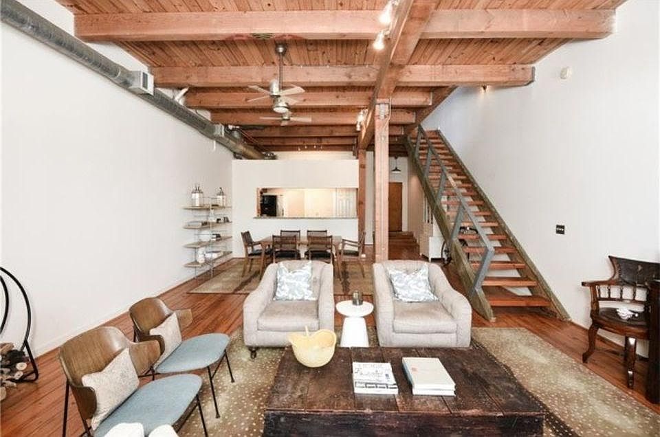 First floor has an open floor plan with high ceiling and ope