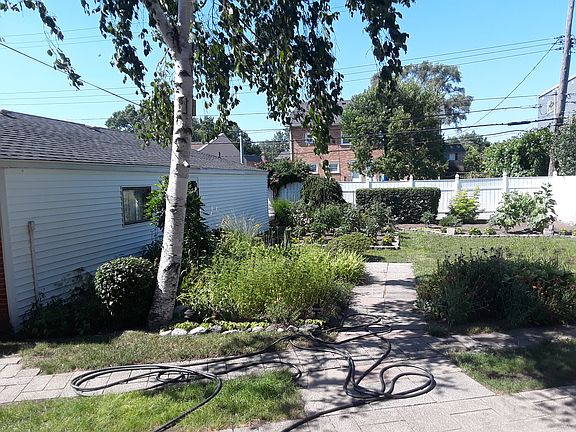 Backyard with gardens and 4 