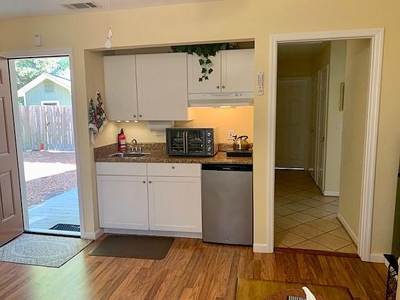 Your side door entry that is open to kitchen-living room. The door that is closed down the hall, is the 1 bedroom, it has a full bed, 2 windows and closet with organizer.