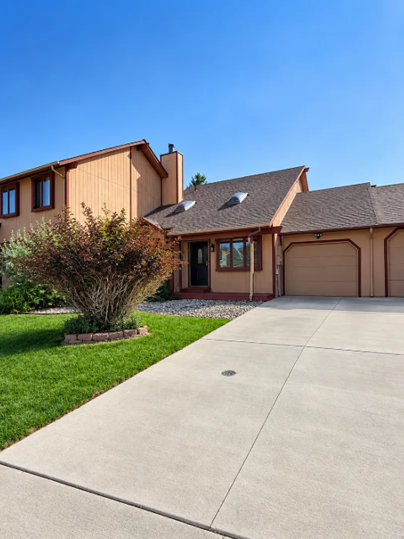 4-Bedroom Home with Finished Basement & Attached Garage — Photo 1
