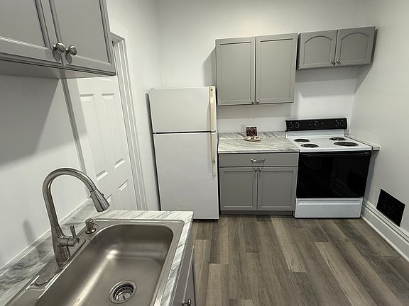 Kitchen fridge to stove.