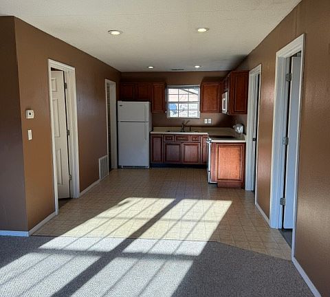Living room looking toward kitchen/dining