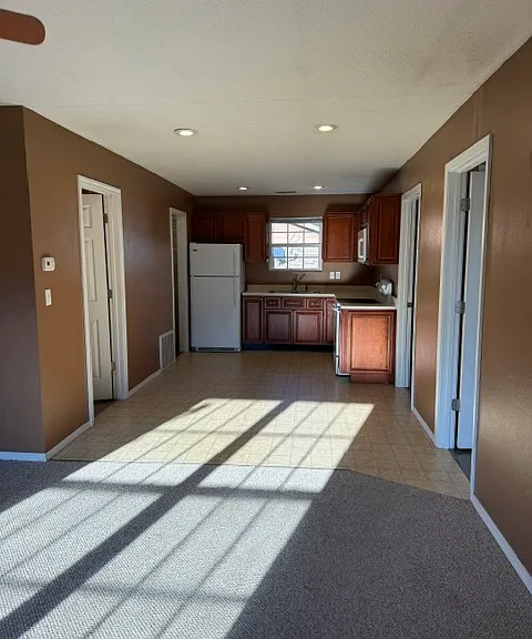 Living room looking toward kitchen/dining
