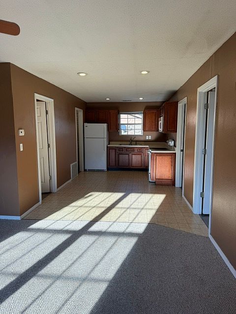 Living room looking toward kitchen/dining