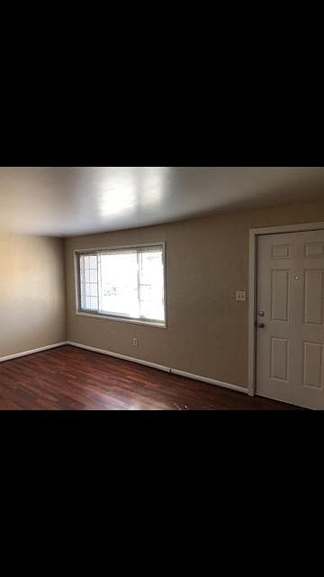 Living room with large picture window with Pike's Peak views!