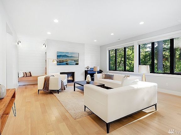 Open great room design with ship-lap detail, edison bulbs and gas fireplace