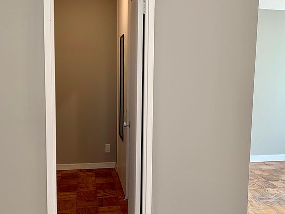 Door leading to bathroom hallway and double closet