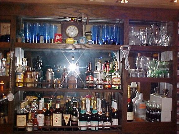bar - added bot center shelf  where b4 sat a tall 1800's brass cash register