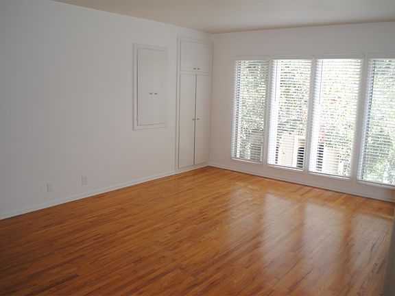 Large spacious living room with newly refinished hardwood fl