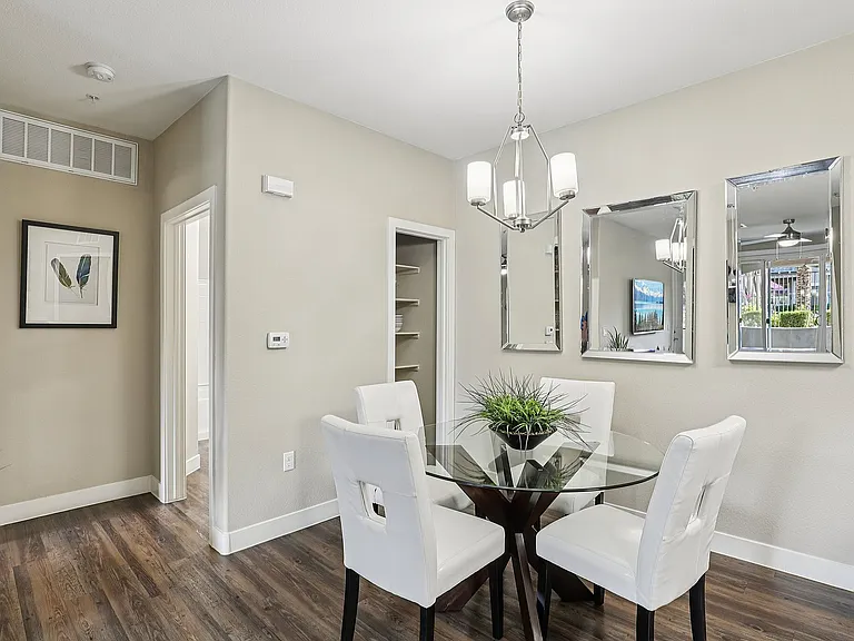 Dining Area with Wood Floors and Modern Lighting