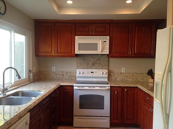 Kitchen with recessed lighting.