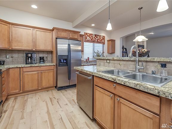 Spacious kitchen overlooks breakfast nook & living room