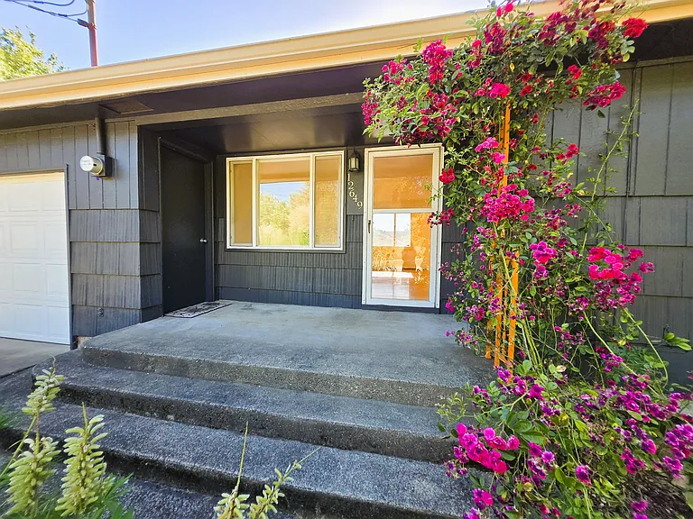 Welcome to North Burien! This mid century charmer has been well-loved and ready for its next chapter. Lovely wide front porch and beautiful rose trellis.