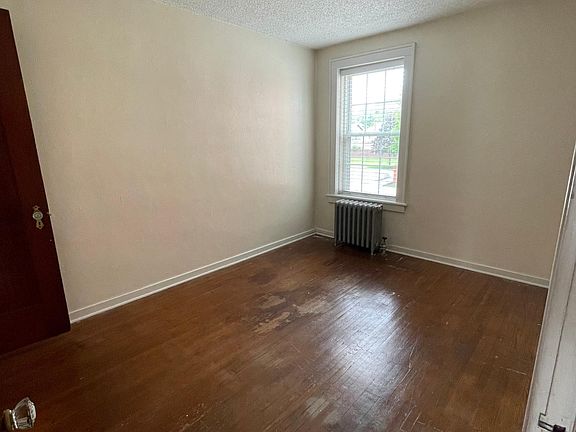 south facing bedroom (floors to be sanded and revitalized)
