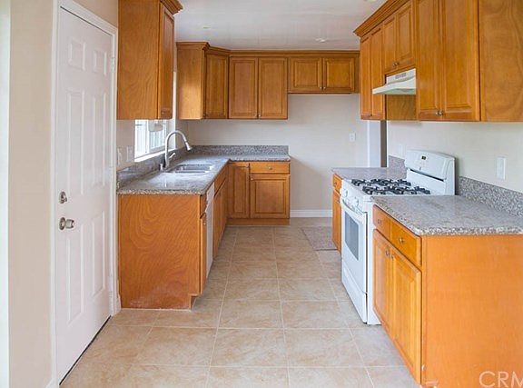 The Kitchen with Granite Countertops and Appliances.