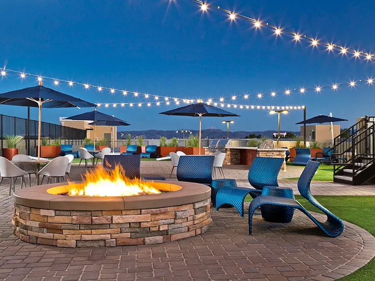 Rooftop lounge with fire pit and loungers