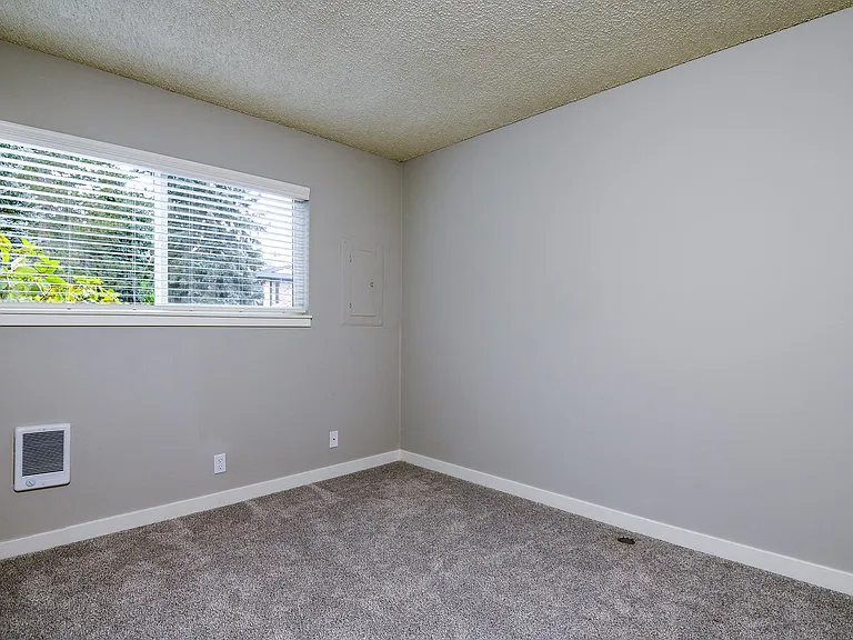 The Hideaway | Bedroom with Wall to Wall Carpet and light filled window