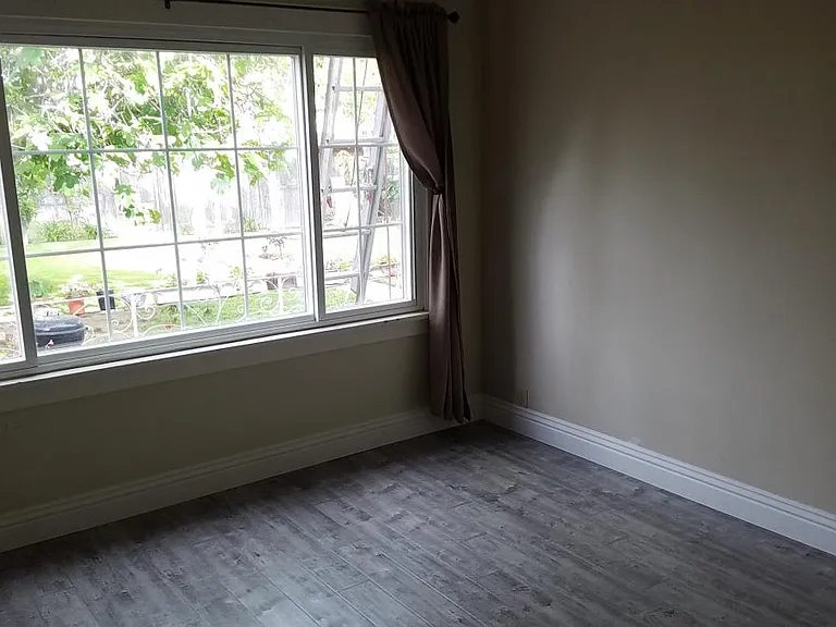 Master bedroom has large picture window facing back yard