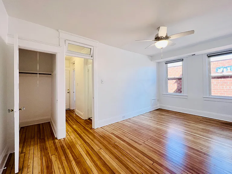 Living room facing the hall with transom window and extra closet