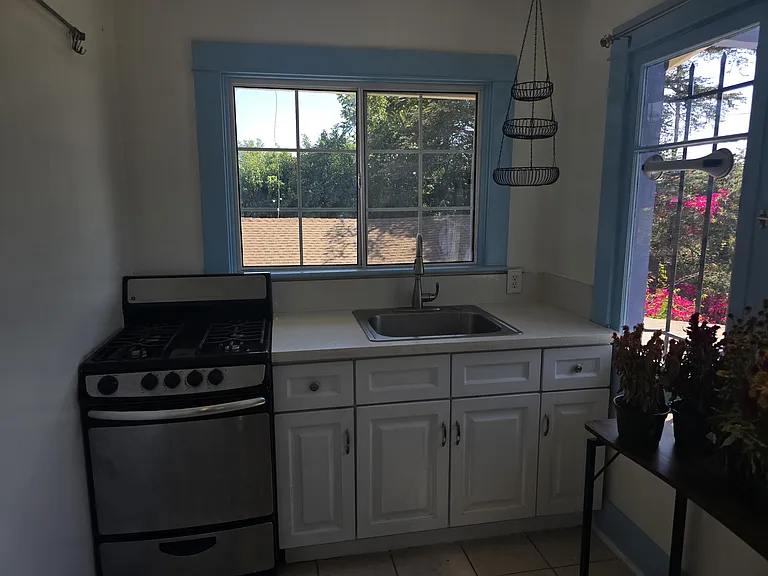 Kitchen area with oven and sink