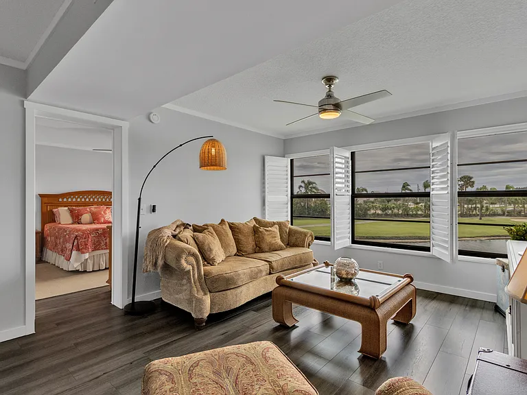 Plantation shutters with lake and golf course views