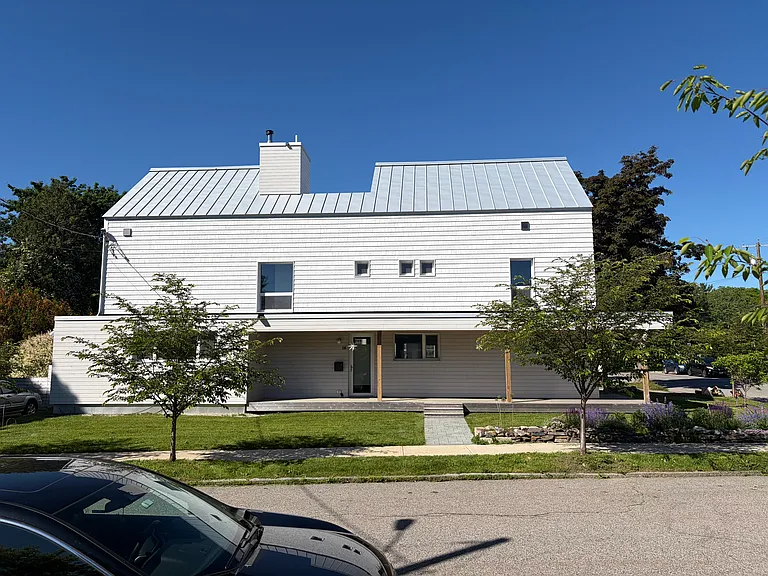 Shared walkway; landlord's front door at left. Tenant's front door around corner to right.