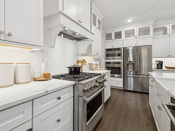 Kitchen with glass upper cabinets