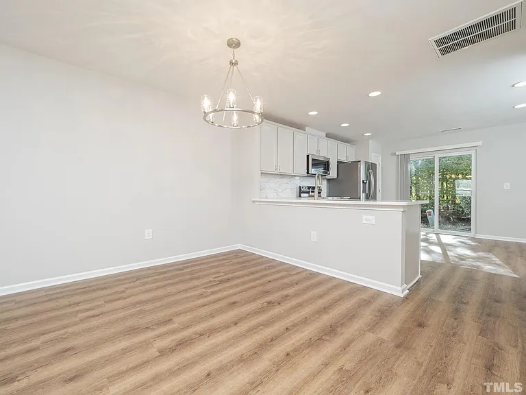 Use this space as either your dining room, or request your landlord to switch the light fixture to use this space for an extended downstairs living room and opt to put your dining table in the open concept kitchen.