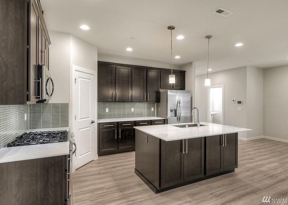 Open Living with Kitchen Island
- LG Dishwasher
- LG Gas Stove
- Cabinets
- Pantry