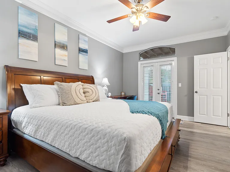 Master bedroom with a king bed on the main level and walkout