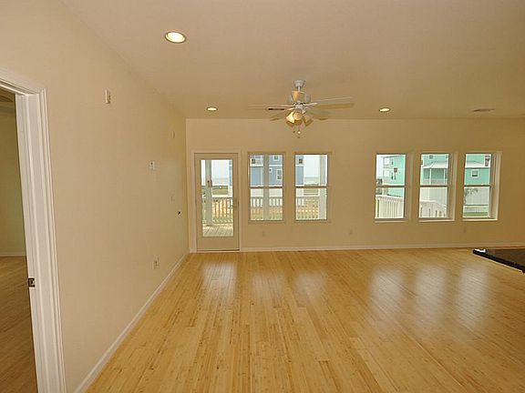 Open floor plan leading to living/dining/kitchen combo