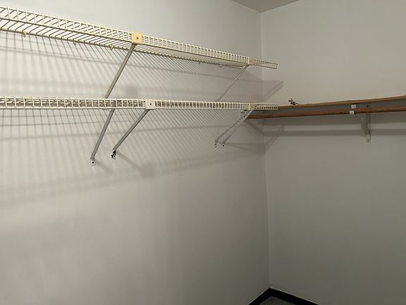 Part of Master Bedroom Walk in Closet.