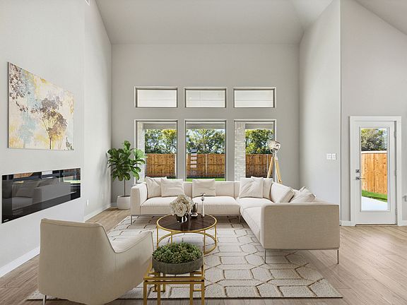 Living Room in the Morrison home plan by Trophy Signature Homes - REPRESENTATIVE PHOTO