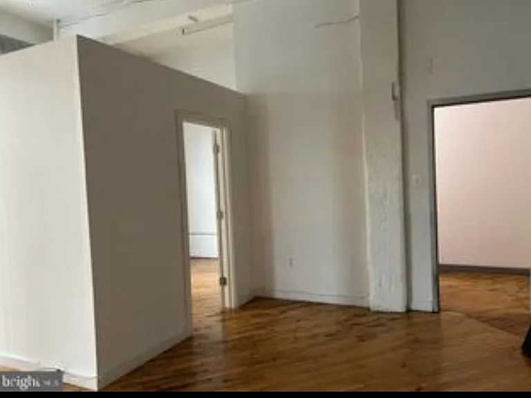 Here, the front door is your right and the entrance to the bedroom is on your left.