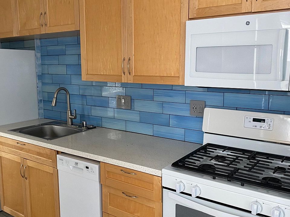 dishwasher, microwave, range, new tile and flooring!