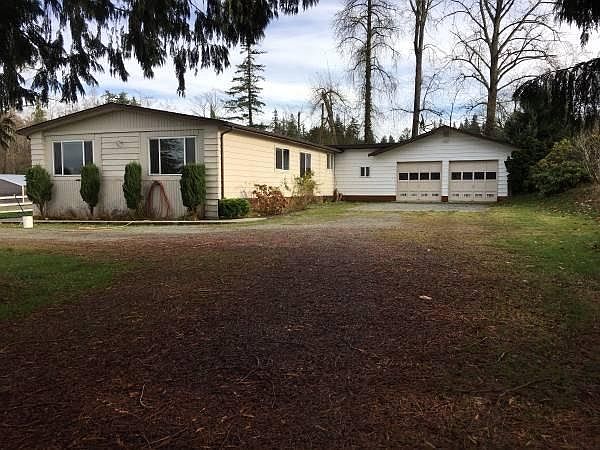 Rambler with attached two car garage