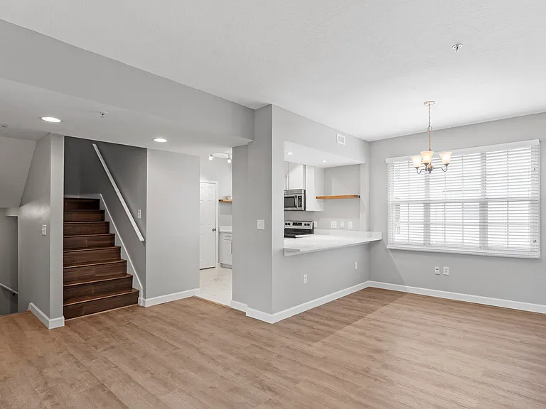 View of the kitchen, bar, and dining room from the living room