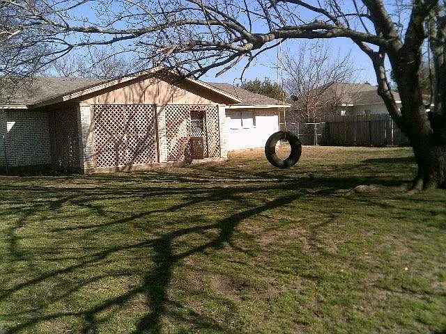 large fenced back yard with covered latice patio also storar - 104 Loraine St