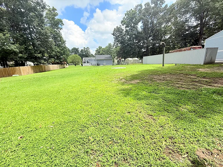 side lot ( not fenced in) is also part of the home for added outdoor space & extra privacy!