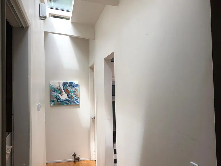 Upstairs hall lined with skylights.