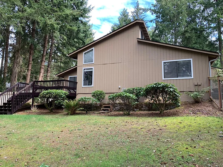 Privacy & tranquility found in this nicely remodeled left unit of the duplex. Newer roof.