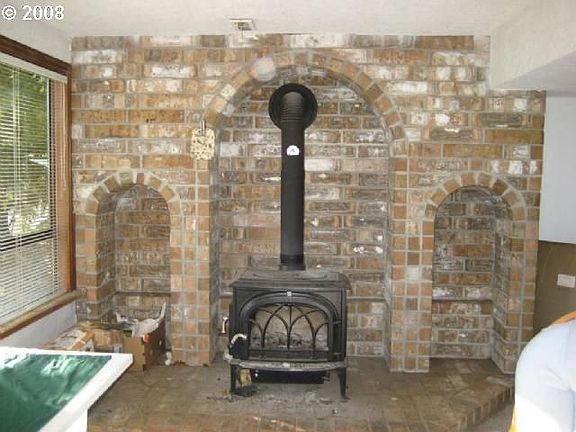 Family Roomand Wood Stove Before New Carpet