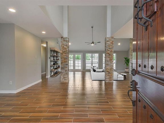 Beautiful views of the soaring ceiling in the great room right when you enter through the front door.