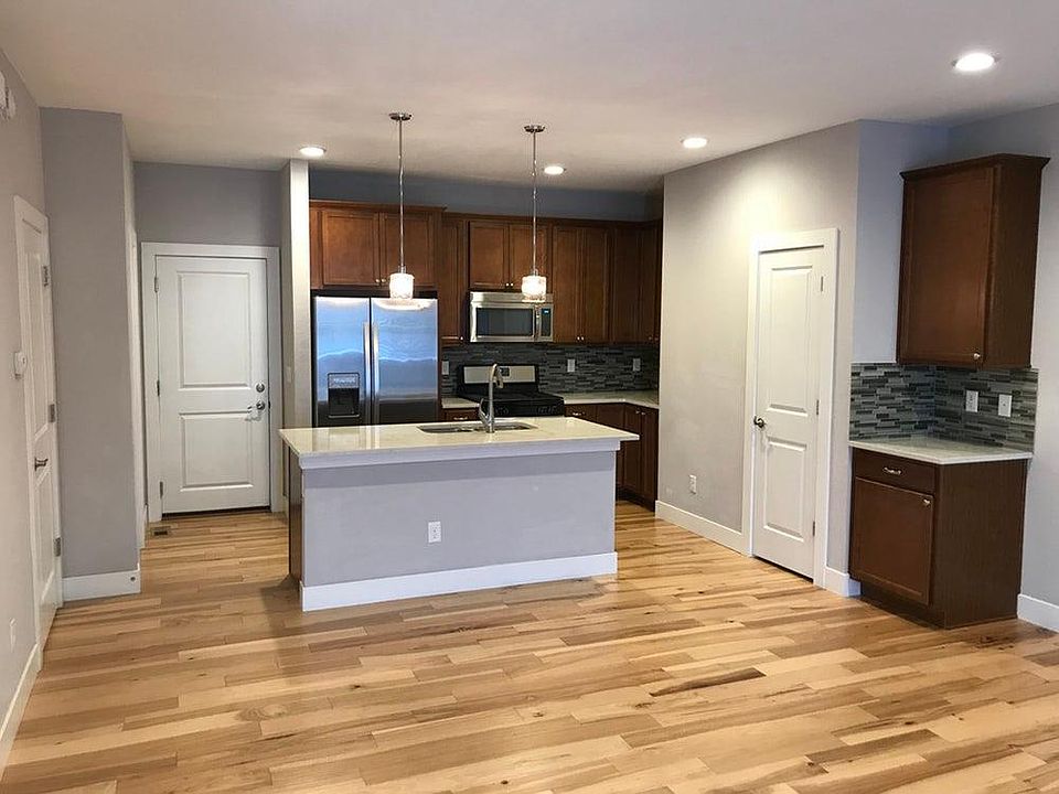 Open floor plan from family room to kitchen.