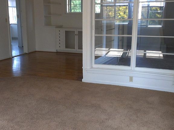 Living room and dining room in background