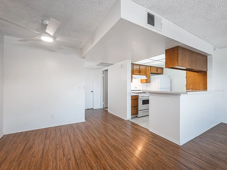 Dining Area & Kitchen Leading into Hallway to Bedroom & Bathroom