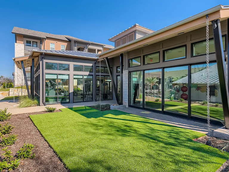 Communal green space outside the fitness center